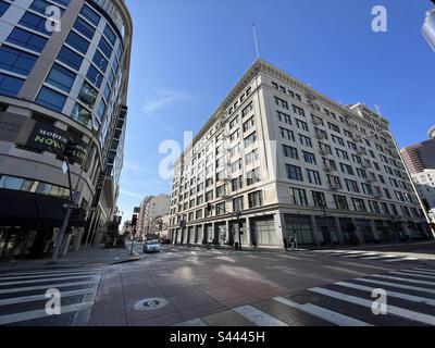 LOS ANGELES, CA, DEC 2022: new and old apartment buildings at the intersection of 4th Street and Broadway in Downtown Stock Photo