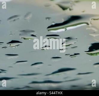 Closeup of raindrops on the windshield. Stock Photo