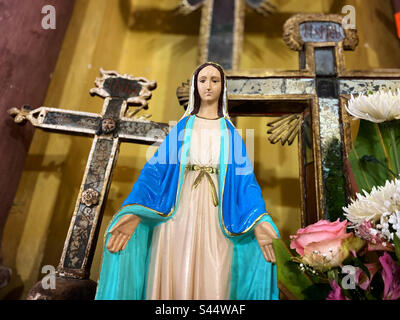 An image of the Virgin Mary surrounded by crosses decorates the Iglesia de San Antonio church in San Antonio de la Cal, Toliman, Queretaro, Mexico Stock Photo