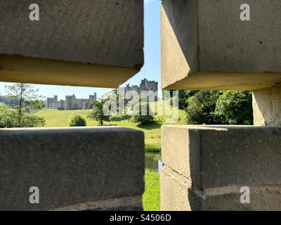 Alnwick castle photographed through a turret slit from the bridge, Northumberland Stock Photo