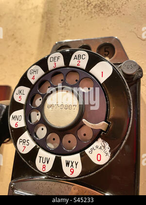 Vintage Rotary dial pay public telephone close-up, 2023, USA Stock Photo
