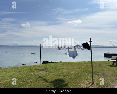 Washing line with clothes blowing in the wind on the island of Islay, Scotland Stock Photo