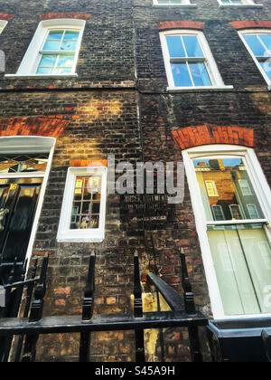 Ghost sign in Lord North Street in Westminster, London SW1 reads: “Public shelters in vaults under pavements in this street.” Second World War directions for public safety from bombs Stock Photo