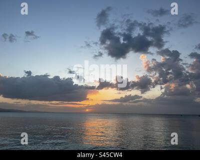 A romantic sunset on the beach at Montego Bay, Jamaica Stock Photo