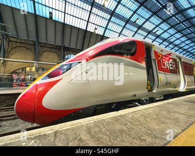 High speed train in LNER livery speeding through the English ...