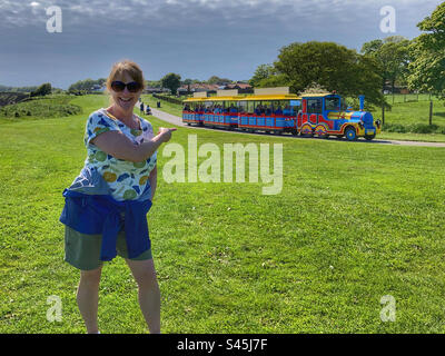 Woman amused by the Land Train at Sewerby East Yorkshire Stock Photo