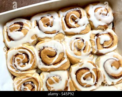 Cinnamon rolls in a white baking dish Stock Photo