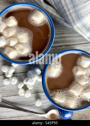 Hot cocoa with marshmallows in blue mugs Stock Photo