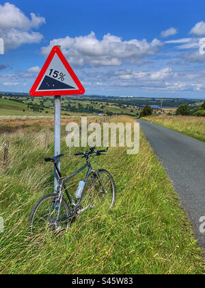 Pace RC200 F5 Mountain Bike leant on a 15% downhill sign North Yorkshire Stock Photo