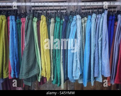 Colorful shorts hanging on a rack Stock Photo
