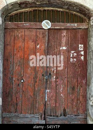 Old red wood door texture detail Stock Photo