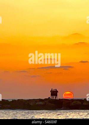 A romantic sunset over the Mediterranean Sea in Tel-Aviv, Israel. Stock Photo