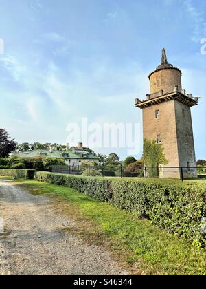 Harkness Memorial State Park in Waterford, Connecticut, USA. Former windmill and carriage house in the distance. Summer day in New England. Stock Photo