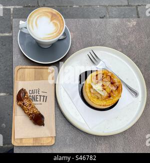 Chocolate cannoli, lemon tart and a cappuccino at Caffe Cognetti Bari Puglia Italy Stock Photo