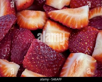 Full frame close-up of fresh, sliced, organic strawberries. Backgrounds.Healthy eating. Freshness. Well-being. Stock Photo