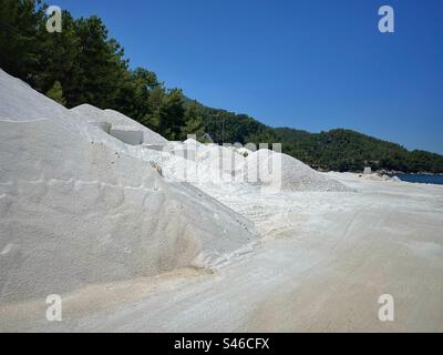 White marble sand and stones near Marble Beach (Saliara) on Thassos island, Greece. Stock Photo