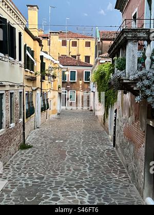 Calle de Vedei, a stone street with beautiful architecture, in the Cannaregio district of Venice on a summer night Stock Photo