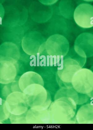 Vertical frame of green glittery bokeh Stock Photo