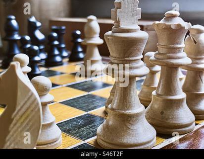 Wooden chess pieces on a board Stock Photo
