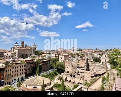 Cityscape and view into the Roman Forum achaelogical site from Orti Farnesiani sul palatino park in Rome. Stock Photo