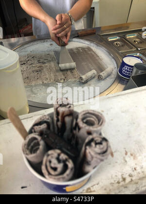 Rolled ice cream being prepared on the South Bank of London alongside the Thames River Stock Photo