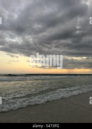 Dark dramatic sunset clouds over the Gulf of Mexico Florida Emerald Coast Stock Photo