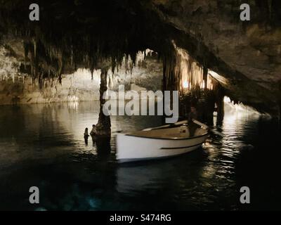 Boat on underground lake inside the Caves of Drach,/ Cuevas del Drach, Majorca Stock Photo