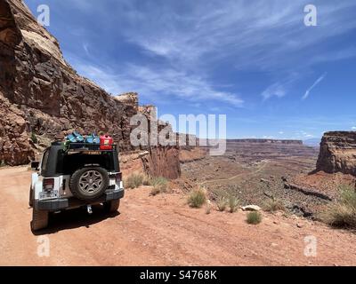 The White Rim Trail in Canyonlands National Park near Moab, Utah is a popular destination for Jeeping.  The remote location requires back country passes, and travelers must pack in their own supplies. Stock Photo