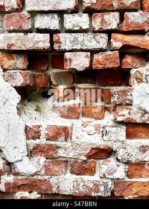 Damaged brick wall Stock Photo