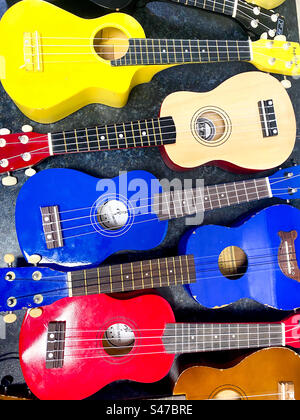 Colourful ukulele string instruments. Stock Photo