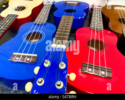 Colourful ukulele string instruments. Stock Photo