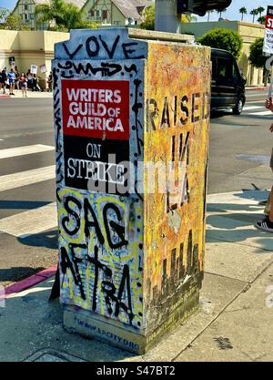 A utility box on near Paramount Pictures Studios’ main gate at Melrose and Bronson avenues in Hollywood was painted in support of WGA and SAG-AFTRA during the 2023 entertainment industry strikes. Stock Photo