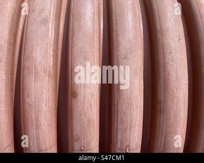 Vertical groove pattern on a barrel in a pink color Stock Photo