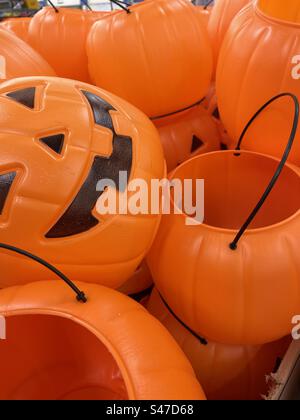 Pumpkin buckets, or pails, stocked for sale at a local Walmart in Utah, USA. Makes a nice seasonal background and abstract image. Stock Photo