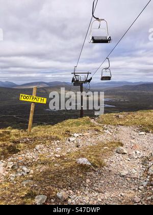 Footpath below chairlift ski lift at the Glencoe Mountain Ski Centre, Scottish mountains with a view of Rannoch Moor Stock Photo