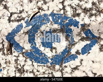 Stencil image of an eye on cracked asphalt Stock Photo