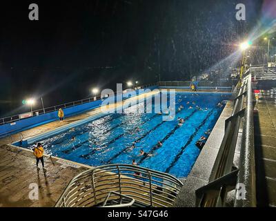 The final Starlight Swim of 2023 at Gourock Outdoor Pool, in the middle of Storm Agnes. Stock Photo