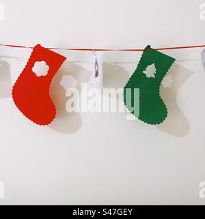 Christmas stocking decorations hanging on the wall Stock Photo