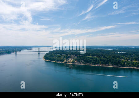 Aerial view of a boat passing through the Tacoma Narrows in June Stock Photo