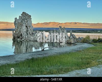 Distinctive tufa (limestone) towers of Mono Lake in central California formed around springs at the bottom of the lake over decades or even centuries and were revealed as water levels fell. Stock Photo