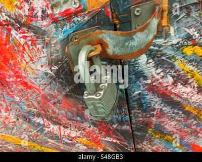 Padlock on painted doors brightening high street up Stock Photo