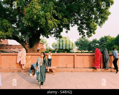 Indian tourists exploring the historic UNESCO World Heritage Site at Fatehpur Sikri near Agra in India Stock Photo