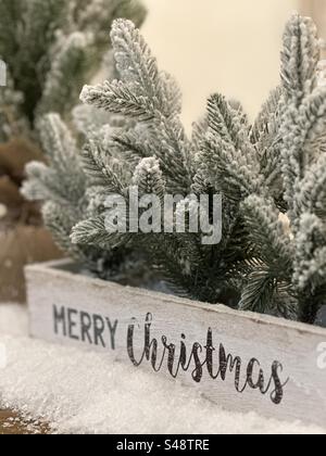 Christmas decorations on a table with message box and pine tree needles Stock Photo