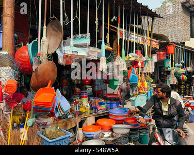 A shop in a market along a street in India selling plastic products for cleaning and other purposes Stock Photo