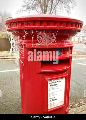 A Royal Mail pillar box on a frosty morning. Stock Photo