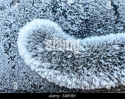 Car wiper covered in ice close up Stock Photo