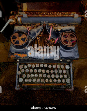Antique, rusted and discarded typewriter Stock Photo