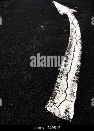 Turning left ahead arrow road markings Stock Photo