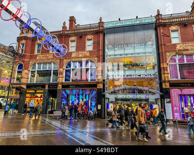 Shopping on Briggate main shopping street in Leeds city centre Stock Photo