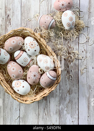 Painted eggs in a basket Stock Photo